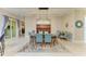 Elegant dining room with stylish chandelier and hutch, offering ample seating at 12175 Maple Ridge Dr, Parrish, FL 34219