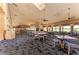 Elegant dining room with fireplace, tables, and large windows offering golf course views for a delightful dining experience at 12175 Maple Ridge Dr, Parrish, FL 34219