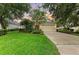 Charming single-story home featuring a well-manicured lawn and attractive landscaping at 12175 Maple Ridge Dr, Parrish, FL 34219