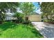 Charming single-story home featuring a well-manicured lawn and a two-car garage at 12175 Maple Ridge Dr, Parrish, FL 34219