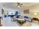 Spacious living room with views of the modern kitchen and stylish furnishings at 12175 Maple Ridge Dr, Parrish, FL 34219