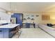 Open floor plan with a bar area and a spacious living room with lots of natural light at 12175 Maple Ridge Dr, Parrish, FL 34219