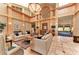 Spacious clubhouse lobby with high ceilings, elegant furnishings, and natural light at 12175 Maple Ridge Dr, Parrish, FL 34219
