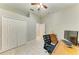 Bright home office featuring a ceiling fan, closet, and wooden desk and chair at 12175 Maple Ridge Dr, Parrish, FL 34219