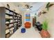 Cozy office space with bookshelves, comfortable chair, and a piano at 12175 Maple Ridge Dr, Parrish, FL 34219