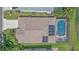 An aerial view of this home's roof and outdoor swimming pool and patio area at 12322 Tall Pines Way, Lakewood Ranch, FL 34202