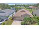 Aerial of home showing landscaping, two-car garage, and well-maintained surroundings at 12322 Tall Pines Way, Lakewood Ranch, FL 34202