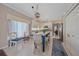 Open-concept kitchen with an island, stainless steel appliances, and view into the dining area at 12322 Tall Pines Way, Lakewood Ranch, FL 34202