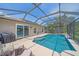 Enjoy this screened-in pool with inviting blue water, poolside seating, and a staircase entry for optimal outdoor relaxation at 12322 Tall Pines Way, Lakewood Ranch, FL 34202