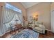 Sitting room with recliners, small table and a large window at 12322 Tall Pines Way, Lakewood Ranch, FL 34202