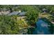 Green backyard features a small pond at 135 Tall Trees Ct, Sarasota, FL 34232