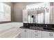 Beautiful bathroom with double sinks, granite countertops, and ample storage at 135 Tall Trees Ct, Sarasota, FL 34232