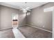 Spacious bedroom featuring neutral tones, plush carpeting, ceiling fan, and plenty of natural light at 135 Tall Trees Ct, Sarasota, FL 34232