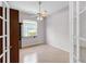 Bright bedroom with hardwood floors and French doors at 135 Tall Trees Ct, Sarasota, FL 34232