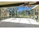 Spacious screened lanai with ample room for outdoor seating and enjoying the backyard scenery at 135 Tall Trees Ct, Sarasota, FL 34232