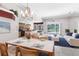Open-concept space featuring a living room, dining area, and a partial view of the kitchen at 135 Tall Trees Ct, Sarasota, FL 34232