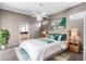 Bedroom suite with a ceiling fan, ensuite bathroom, and neutral color palette at 135 Tall Trees Ct, Sarasota, FL 34232
