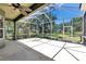 Large screened-in patio provides plenty of space for relaxing, dining, and entertaining at 135 Tall Trees Ct, Sarasota, FL 34232