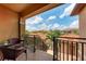 View from a balcony with furniture overlooking neighborhood with red tile roofs at 13710 Messina Loop # 201, Bradenton, FL 34211
