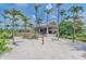 Beach bar on a sandy patch surrounded by lush palms, offering a relaxing seaside experience at 13710 Messina Loop # 201, Bradenton, FL 34211