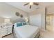 Comfortable bedroom with a plush bed, white furniture, and closet at 13710 Messina Loop # 201, Bradenton, FL 34211