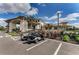 Stunning clubhouse exterior with golf carts parked in front, set against a beautiful sunny sky at 13710 Messina Loop # 201, Bradenton, FL 34211