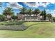 Elegant stone community sign surrounded by lush landscaping, welcomes residents to Esplanade Golf and Country Club at 13710 Messina Loop # 201, Bradenton, FL 34211