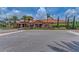 Exterior of a clubhouse with lush landscaping and a well-maintained entrance at 13710 Messina Loop # 201, Bradenton, FL 34211