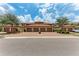 View of home exteriors with garages, lush landscaping and paved driveway at 13710 Messina Loop # 201, Bradenton, FL 34211