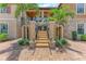 Exterior view of stairs leading to the second floor with palm trees on each side at 13710 Messina Loop # 201, Bradenton, FL 34211