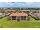 Beautiful low-rise condominium complex features manicured lawns and tile roofs in a serene community setting at 13710 Messina Loop # 201, Bradenton, FL 34211
