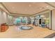 Spacious gym with hardwood floors featuring cardio machines, weights, and exercise equipment at 13710 Messina Loop # 201, Bradenton, FL 34211