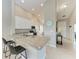 Bright kitchen featuring granite countertops, bar stool seating, recessed lights and stainless steel appliances at 13710 Messina Loop # 201, Bradenton, FL 34211