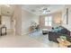 Inviting living room with blue accent rug, couch, and desk area at 13710 Messina Loop # 201, Bradenton, FL 34211