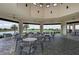 Charming outdoor seating area with views of the golf course and surrounding landscape at 13710 Messina Loop # 201, Bradenton, FL 34211