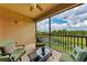 Enjoy serene water views from this covered patio with comfortable seating and lush landscaping at 13710 Messina Loop # 201, Bradenton, FL 34211
