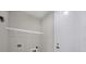 A well-lit laundry room includes shelving, hookups, and a door to the house at 14065 Paris Ln, Port Charlotte, FL 33981