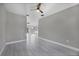Spacious living room featuring wood-look tile flooring and recessed lighting at 14065 Paris Ln, Port Charlotte, FL 33981