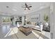 Bright living room with neutral tones, modern furnishings, and lots of natural light at 14065 Paris Ln, Port Charlotte, FL 33981