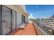 Large balcony with seating offers serene views of the surrounding area at 1465 Gulf Of Mexico Dr # 502, Longboat Key, FL 34228