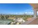 Balcony view of the tennis court and scenic landscaping, offering a glimpse of the property's amenities at 1465 Gulf Of Mexico Dr # 502, Longboat Key, FL 34228