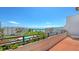 Relax on the balcony and enjoy views of lush grounds, a pool, and the azure ocean at 1465 Gulf Of Mexico Dr # 502, Longboat Key, FL 34228