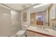 Well-lit bathroom with a shower, a sink, a large mirror, and tile flooring; a clean and functional space at 1465 Gulf Of Mexico Dr # 502, Longboat Key, FL 34228