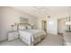 Cozy bedroom featuring neutral decor, carpeted floors, and well-placed lighting for a warm ambiance at 1465 Gulf Of Mexico Dr # 502, Longboat Key, FL 34228