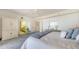 Bedroom featuring water views, access to a private outdoor deck, and closet space at 1465 Gulf Of Mexico Dr # 502, Longboat Key, FL 34228