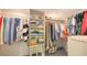 Well-organized walk-in closet with ample shelving and hanging space for clothing and accessories at 1465 Gulf Of Mexico Dr # 502, Longboat Key, FL 34228