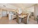 Elegant dining area adjacent to an open kitchen and living space is perfect for entertaining at 1465 Gulf Of Mexico Dr # 502, Longboat Key, FL 34228