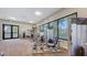 Well-equipped fitness center featuring modern exercise machines and expansive windows with serene views at 1465 Gulf Of Mexico Dr # 502, Longboat Key, FL 34228