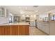 Bright, open kitchen with stainless steel appliances, white countertops, tiled backsplash, and an island at 1465 Gulf Of Mexico Dr # 502, Longboat Key, FL 34228