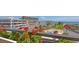 Balcony view shows pool, lawns, beach, ocean and building exteriors at 1465 Gulf Of Mexico Dr # 502, Longboat Key, FL 34228